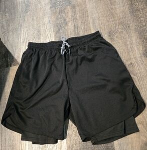 Euc size M gym shorts with inner spandex shorts. 6" inseam, black, zip pocket.